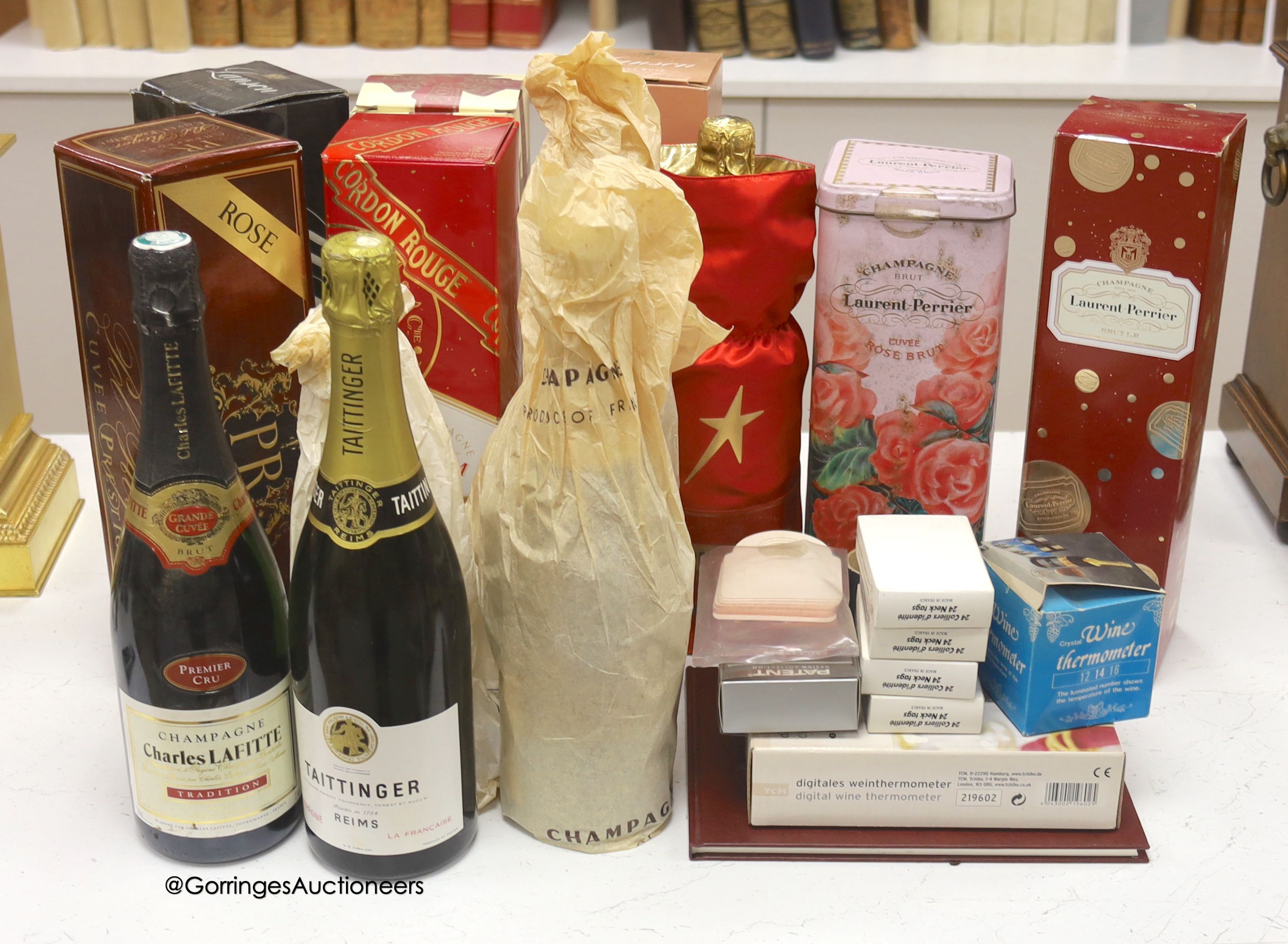Twelve assorted bottles of champagne including Lanson Pol Roger Jean Rocher and wine related items